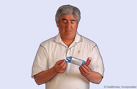 Picture of a man removing the cap from the spacer