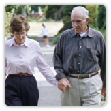 Picture of a man and a woman walking while holding hands